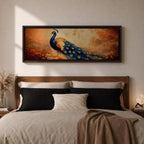 A long panoramic painting of a vibrant peacock standing in an autumn landscape with its long blue and gold tail feathers flowing across the composition. The bird displays detailed eye patterned plumage while warm sunset tones and delicate foliage create a serene nature scene in a wide horizontal format.