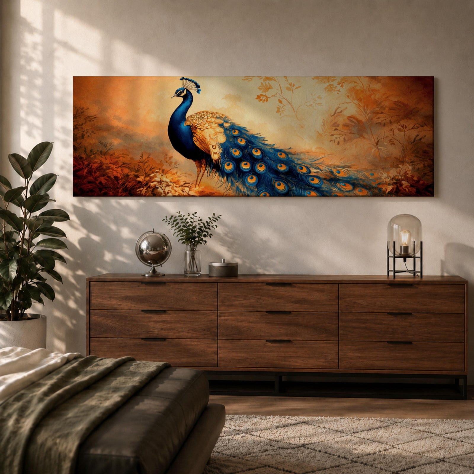 A long panoramic painting of a vibrant peacock standing in an autumn landscape with its long blue and gold tail feathers flowing across the composition. The bird displays detailed eye patterned plumage while warm sunset tones and delicate foliage create a serene nature scene in a wide horizontal format.