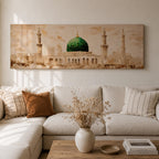 A long panoramic painting of the Green Dome of Masjid Nabawi in Medina rising above elegant mosque arches and courtyards. Tall slender minarets frame the sacred structure while soft beige and golden tones create a historic Islamic architectural scene centered on the iconic green dome in a wide horizontal composition.