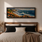 A long panoramic coastal painting showing ocean waves crashing against rocky cliffs while bright orange wildflowers bloom along the shoreline. Deep blue water and white sea foam move toward the coast beneath a clear sky, creating a vibrant seascape landscape in a wide horizontal composition.