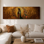 A long panoramic artwork depicting Our Lady of Guadalupe standing in prayer with folded hands and bowed head. She wears a green star covered mantle over a rose colored gown and is surrounded by radiant golden rays and a wreath of vibrant flowers, forming a traditional Catholic Marian image in a wide horizontal composition.