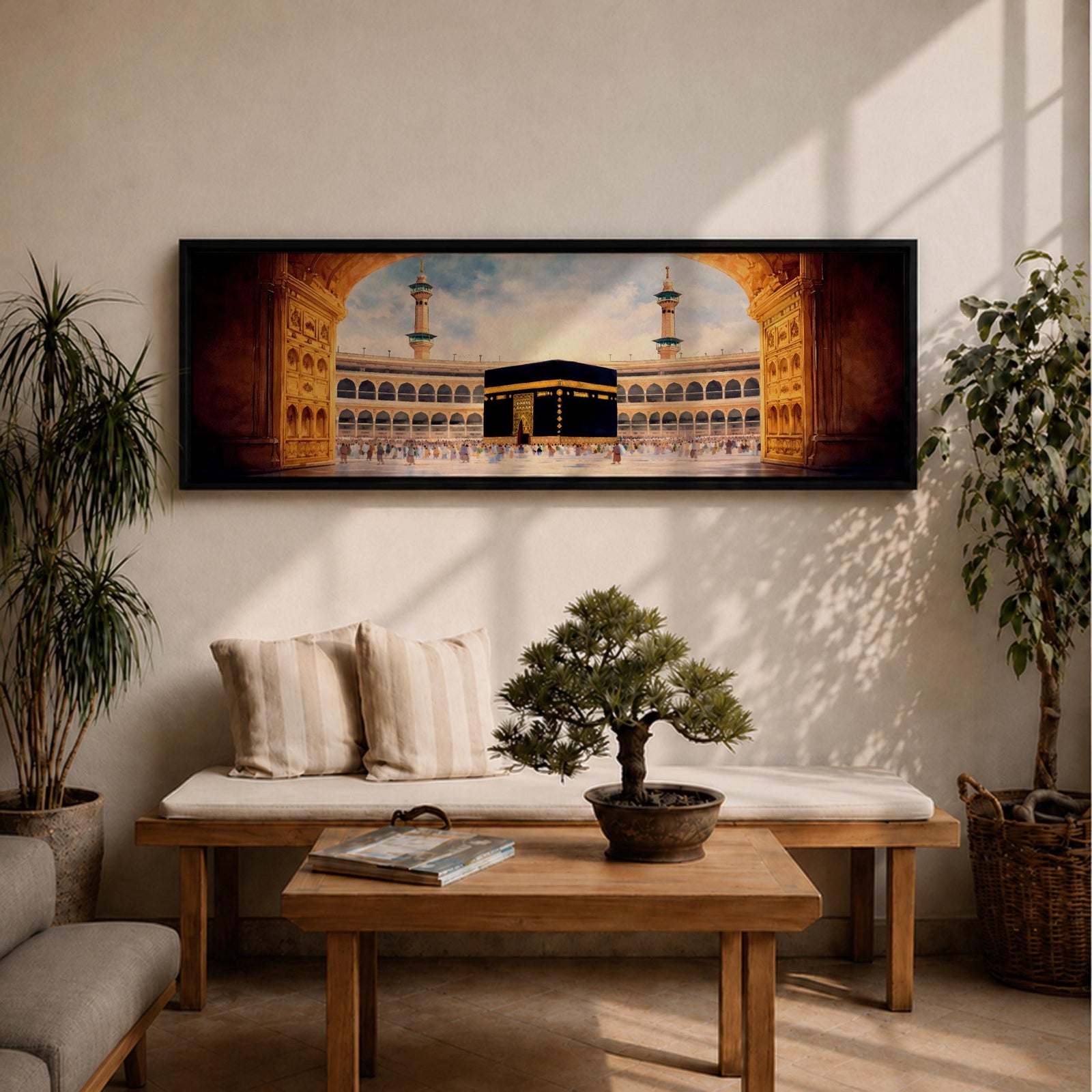 A long panoramic artwork depicting the Kaaba at the center of Masjid Al Haram in Mecca framed by grand mosque arches and tall minarets. The sacred black cube stands in the courtyard while pilgrims gather around it, creating a wide horizontal composition highlighting the holy Islamic sanctuary.