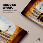 A long panoramic artwork depicting the Kaaba at the center of Masjid Al Haram in Mecca framed by grand mosque arches and tall minarets. The sacred black cube stands in the courtyard while pilgrims gather around it, creating a wide horizontal composition highlighting the holy Islamic sanctuary.