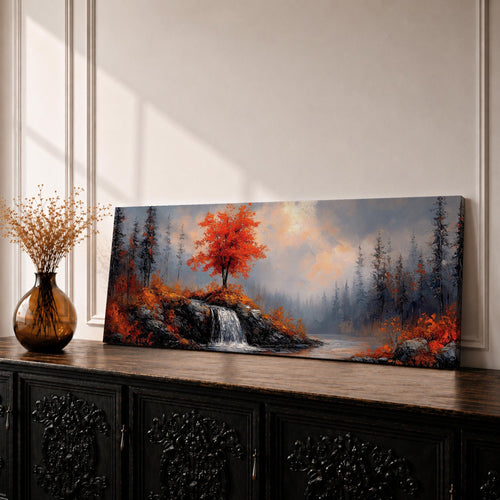 A long panoramic landscape painting showing a small waterfall flowing over rocky cliffs beneath a vivid red autumn tree. Surrounding forest trees fade into misty blue tones while bright fall foliage and rugged stones frame the stream, forming a tranquil woodland scene across a wide horizontal composition.