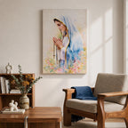 A watercolor style framed canvas depicting Virgin Mary in profile, wearing a blue and white veil with gold trim, holding a rosary and praying, surrounded by soft floral colors and a gentle light background.