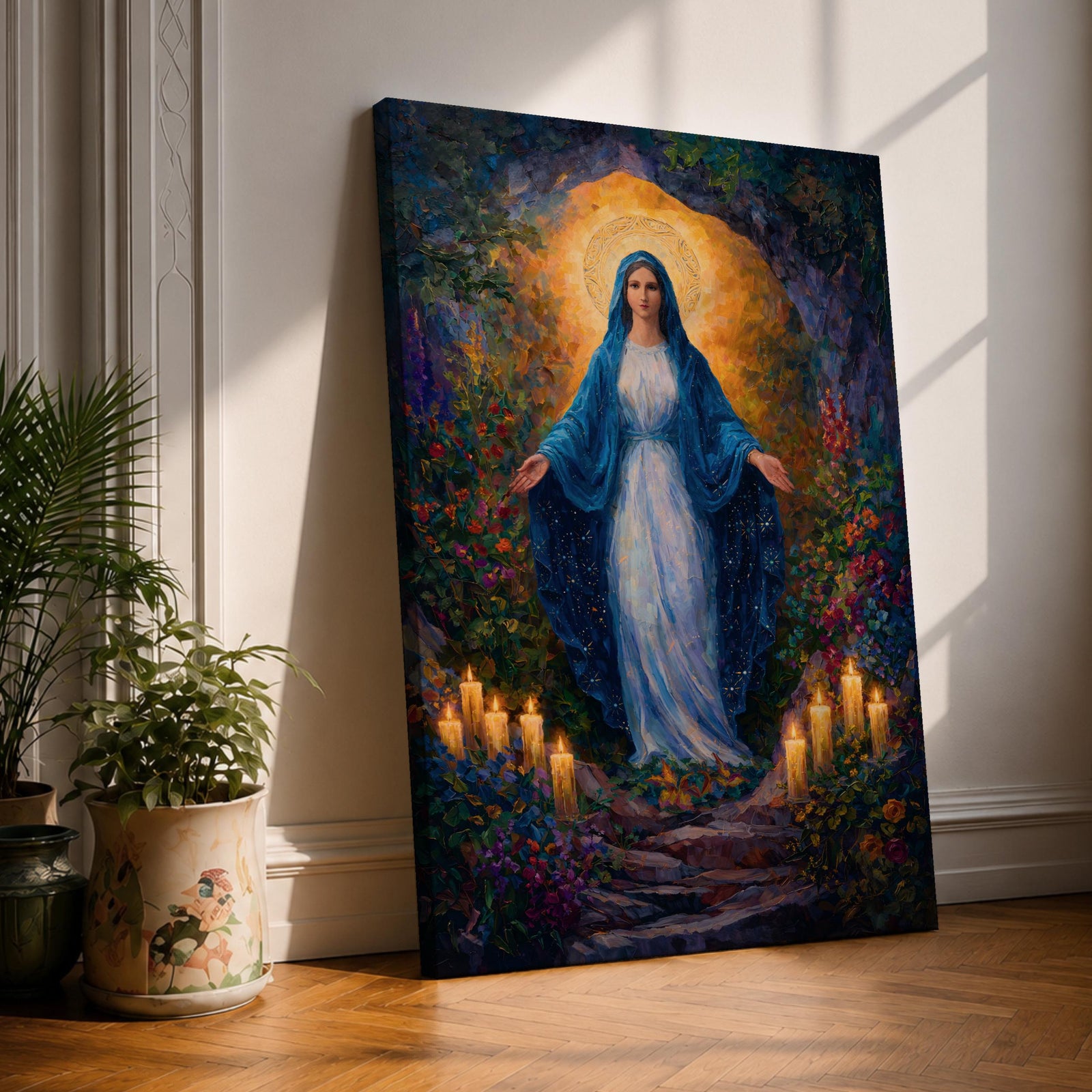 A framed canvas painting of Our Lady of Lourdes depicts the Virgin Mary standing with open arms surrounded by glowing candles and vibrant flowers, rendered in a richly detailed, realistic style with a luminous halo behind her head, evoking a serene and reverent atmosphere.