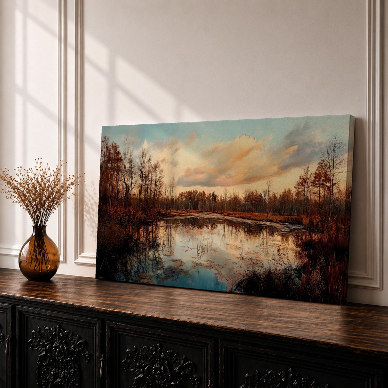 A panoramic painting of a calm lake reflecting autumn trees and a soft sunset sky, with warm earthy tones and bare branches lining the water, rendered in a realistic impressionistic style across a wide landscape composition.