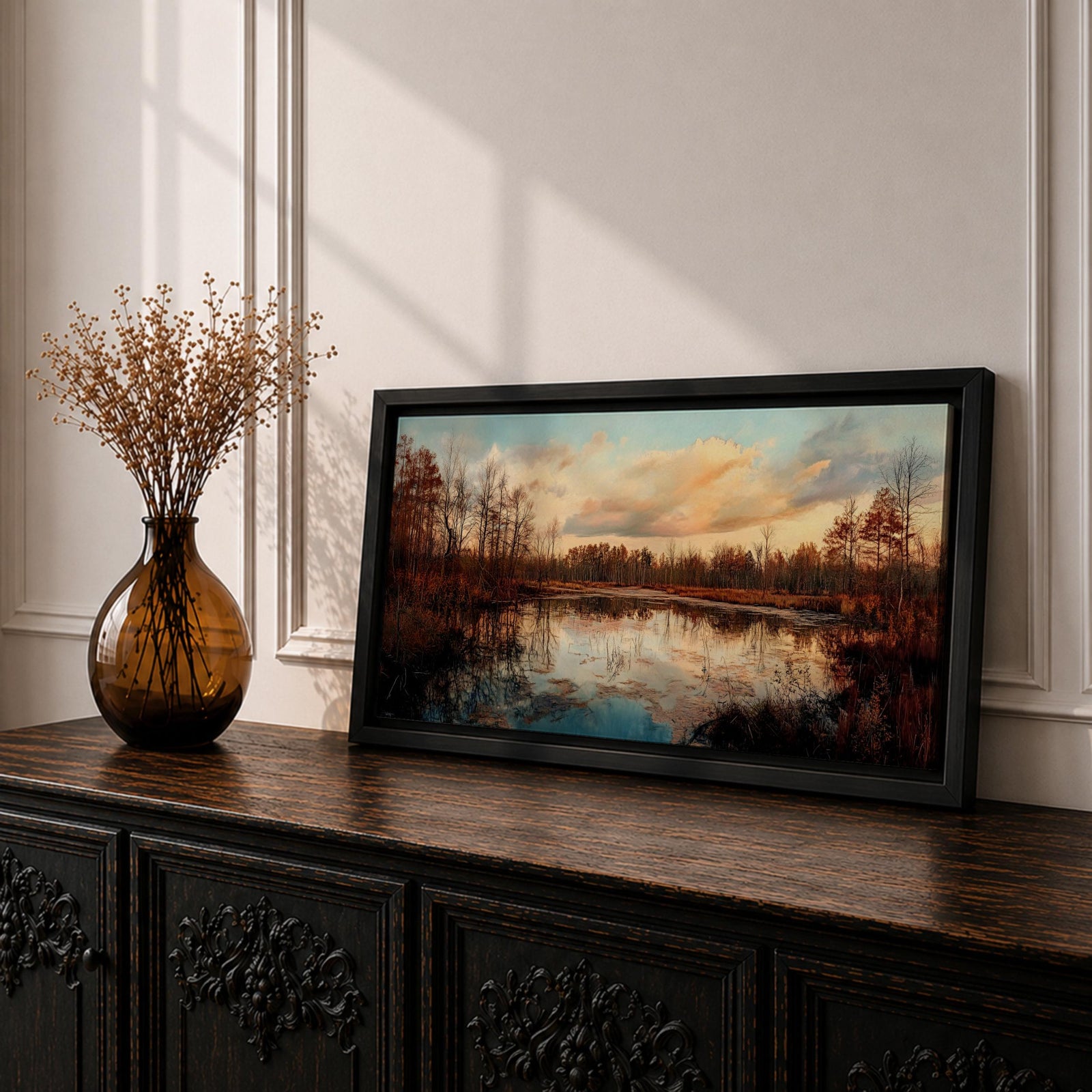 A panoramic painting of a calm lake reflecting autumn trees and a soft sunset sky, with warm earthy tones and bare branches lining the water, rendered in a realistic impressionistic style across a wide landscape composition.