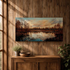 A panoramic painting of a calm lake reflecting autumn trees and a soft sunset sky, with warm earthy tones and bare branches lining the water, rendered in a realistic impressionistic style across a wide landscape composition.