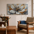A panoramic abstract painting of a large white flower in full bloom, featuring layered petals with soft gray shading and a detailed textured center, accented by expressive gold brushstrokes that radiate outward, creating depth and contrast across a modern extra wide floral composition.