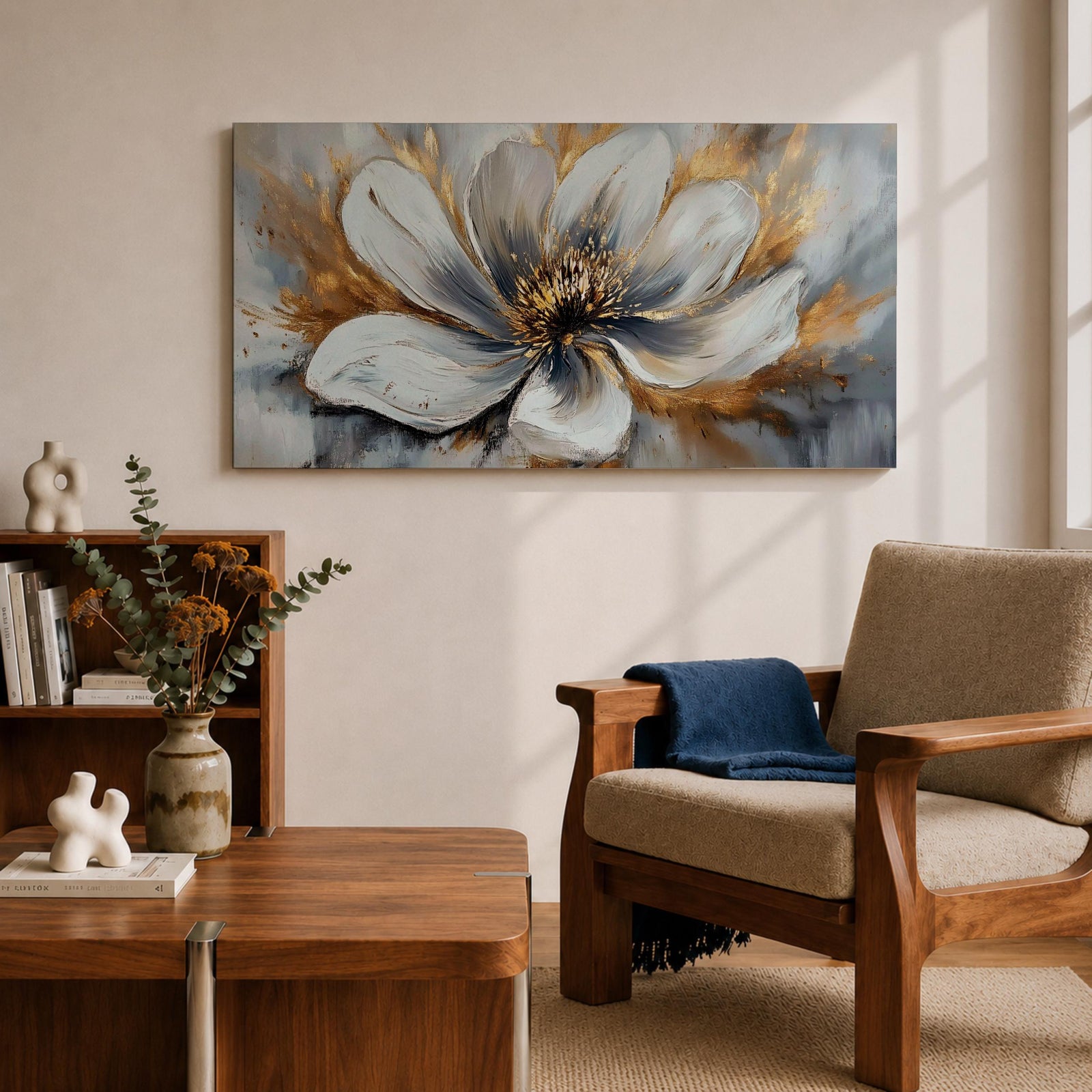A panoramic abstract painting of a large white flower in full bloom, featuring layered petals with soft gray shading and a detailed textured center, accented by expressive gold brushstrokes that radiate outward, creating depth and contrast across a modern extra wide floral composition.