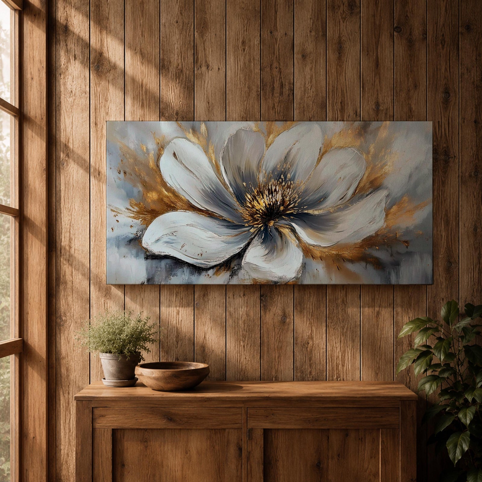 A panoramic abstract painting of a large white flower in full bloom, featuring layered petals with soft gray shading and a detailed textured center, accented by expressive gold brushstrokes that radiate outward, creating depth and contrast across a modern extra wide floral composition.