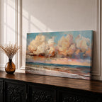 A panoramic impressionist seascape painting of ocean waves rolling onto shore beneath a vast sky filled with large dramatic clouds in soft peach, cream, and blue tones, with textured brushstrokes capturing light reflecting across the water and horizon, creating a serene yet dynamic coastal atmosphere.