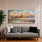 A panoramic impressionist seascape painting of ocean waves rolling onto shore beneath a vast sky filled with large dramatic clouds in soft peach, cream, and blue tones, with textured brushstrokes capturing light reflecting across the water and horizon, creating a serene yet dynamic coastal atmosphere.