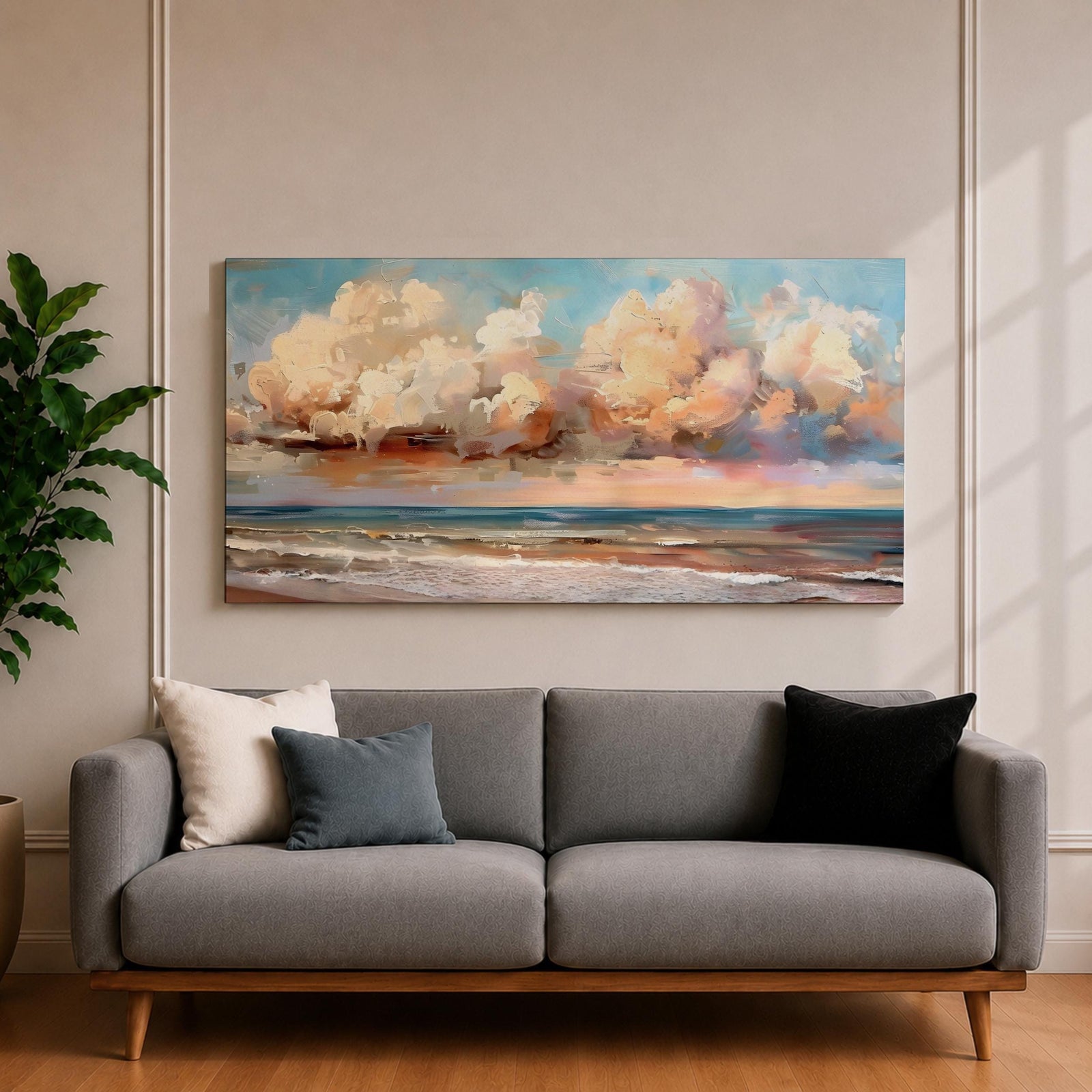 A panoramic impressionist seascape painting of ocean waves rolling onto shore beneath a vast sky filled with large dramatic clouds in soft peach, cream, and blue tones, with textured brushstrokes capturing light reflecting across the water and horizon, creating a serene yet dynamic coastal atmosphere.