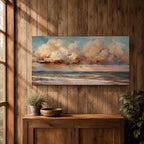 A panoramic impressionist seascape painting of ocean waves rolling onto shore beneath a vast sky filled with large dramatic clouds in soft peach, cream, and blue tones, with textured brushstrokes capturing light reflecting across the water and horizon, creating a serene yet dynamic coastal atmosphere.