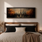 A long narrow panoramic painting depicts the Eiffel Tower rising above a river with an arched bridge in the foreground, surrounded by autumn trees and a distant city skyline, rendered in textured brushstrokes with warm golden tones and soft reflections that create depth and a romantic atmospheric cityscape.