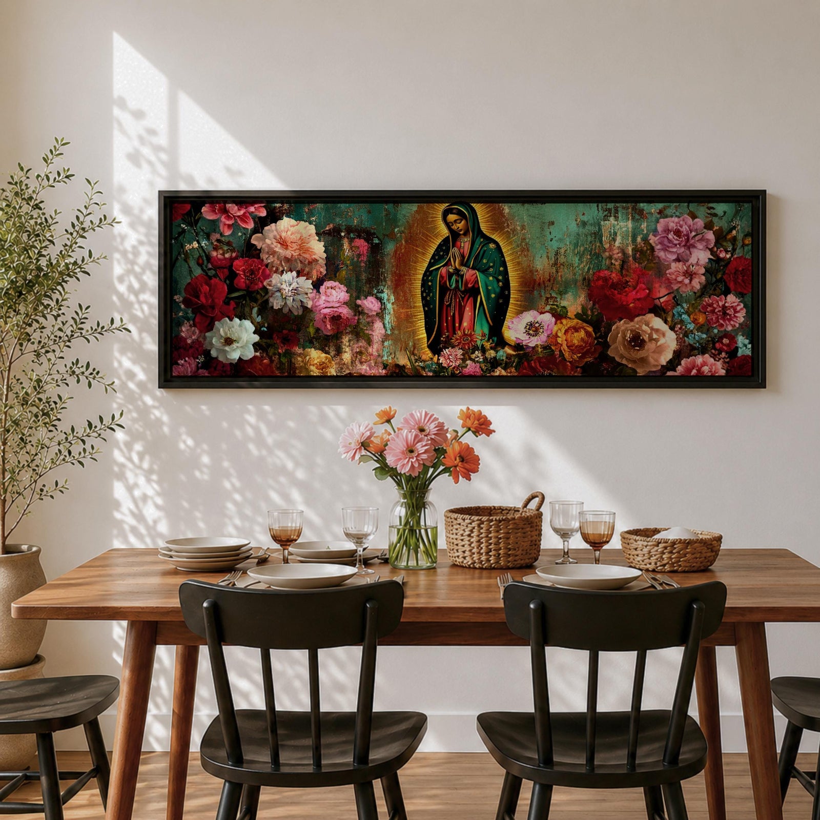 A long narrow panoramic painting shows Virgen de Guadalupe centered in prayer within a radiant halo, surrounded by richly detailed blooming flowers, with textured abstract layers and deep earthy tones blending with vibrant florals to create depth, contrast, and a luminous devotional focal point in an expressive style.