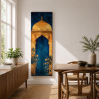 A tall vertical artwork depicting a stylized mihrab with a golden domed top and ornate arch framing a deep blue interior, accented with delicate floral motifs along the base, combining traditional Islamic architectural elements with a refined painterly style and strong vertical symmetry