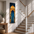 A tall vertical artwork depicting a stylized mihrab with a golden domed top and ornate arch framing a deep blue interior, accented with delicate floral motifs along the base, combining traditional Islamic architectural elements with a refined painterly style and strong vertical symmetry