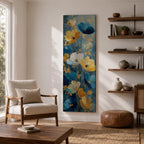 A tall, narrow vertical painting of stylized poppy flowers in layered teal, navy, gold, and soft white tones, featuring textured brushstrokes and metallic accents, with blooms rising along slender stems against a deep blue abstract background, creating a contemporary floral composition with rich contrast and flowing movement.