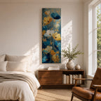 A tall, narrow vertical painting of stylized poppy flowers in layered teal, navy, gold, and soft white tones, featuring textured brushstrokes and metallic accents, with blooms rising along slender stems against a deep blue abstract background, creating a contemporary floral composition with rich contrast and flowing movement.