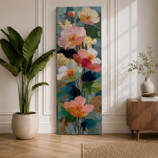 A tall, narrow vertical painting of soft pastel poppy flowers in shades of blush pink, coral, cream, and muted yellow, layered with textured brushstrokes and accented by hints of gold against a cool blue abstract background, with delicate stems and leaves creating a balanced contemporary floral composition.