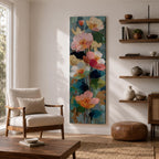 A tall, narrow vertical painting of soft pastel poppy flowers in shades of blush pink, coral, cream, and muted yellow, layered with textured brushstrokes and accented by hints of gold against a cool blue abstract background, with delicate stems and leaves creating a balanced contemporary floral composition.
