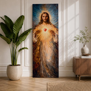 A tall vertical painting depicts Jesus Christ with a serene expression, long flowing hair, and a radiant halo, holding a glowing sacred heart at his chest that emits beams of golden light, rendered in warm tones with soft brushwork and luminous effects that create a spiritual and symbolic religious composition.