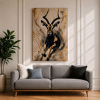 Striking gazelle wall art featuring a graceful antelope in motion with elegant curved horns against a contemporary abstract background. Wildlife artwork with dramatic black and gold tones, expressive splatter details, and luxurious gold accents, perfect for modern, safari, and nature-inspired interiors.