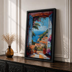 Colorful Mediterranean coastal village seen through open blue shutters overlooking a sparkling sea. Terracotta rooftops, blooming flowers, palm trees, and boats create a vibrant Italian seaside landscape in an impressionist-style framed canvas wall art.