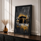 Abstract Kaaba wall art featuring the Holy Kaaba at Masjid al Haram rendered in dramatic black, charcoal, and gold tones. Expressive brushwork, metallic-style gold accents, and a contemporary composition create a striking Islamic focal point.