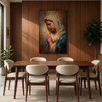 Sacred Catholic wall art featuring the Virgin Mary in prayer with hands clasped and eyes gently lowered. Soft golden light illuminates her serene expression, while rich blue garments and impressionist brushwork create a timeless devotional portrait ideal for prayer rooms and Christian homes.