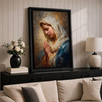 Sacred Catholic wall art featuring the Virgin Mary in prayer with hands clasped and eyes gently lowered. Soft golden light illuminates her serene expression, while rich blue garments and impressionist brushwork create a timeless devotional portrait ideal for prayer rooms and Christian homes.