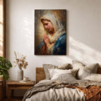 Sacred Catholic wall art featuring the Virgin Mary in prayer with hands clasped and eyes gently lowered. Soft golden light illuminates her serene expression, while rich blue garments and impressionist brushwork create a timeless devotional portrait ideal for prayer rooms and Christian homes.