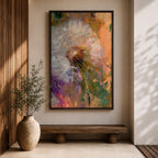 Close-up of a dandelion seed head with fine white filaments against a colorful abstract background featuring warm tones of orange, purple, and green, rendered in an abstract botanical style on a framed canvas.