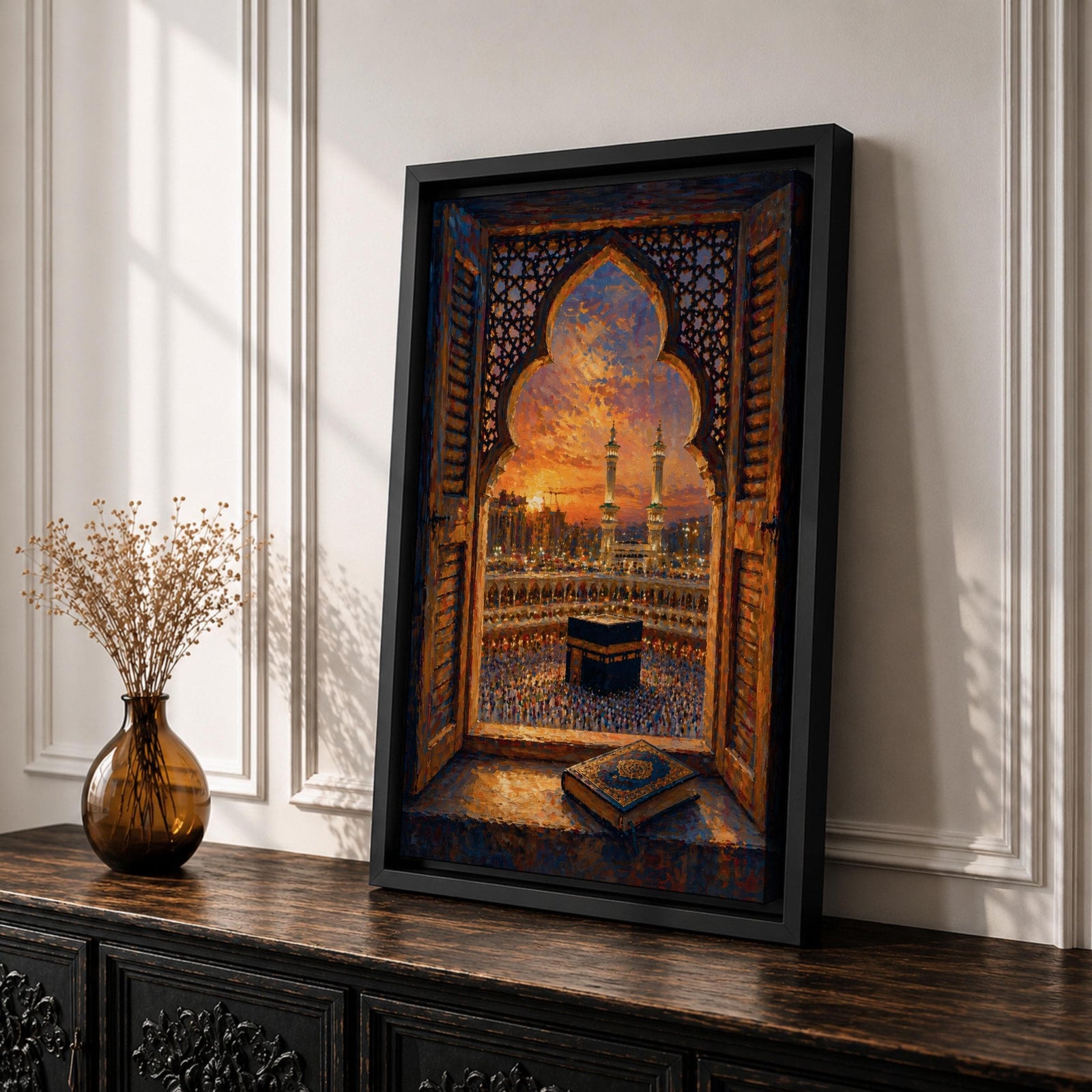 Kaaba wall art viewed through an ornate Islamic arch window overlooking Masjid al Haram at sunset. Featuring the Holy Kaaba, illuminated minarets, and an open Quran in the foreground, this impasto-style Islamic artwork captures a peaceful moment of faith, prayer, and devotion.