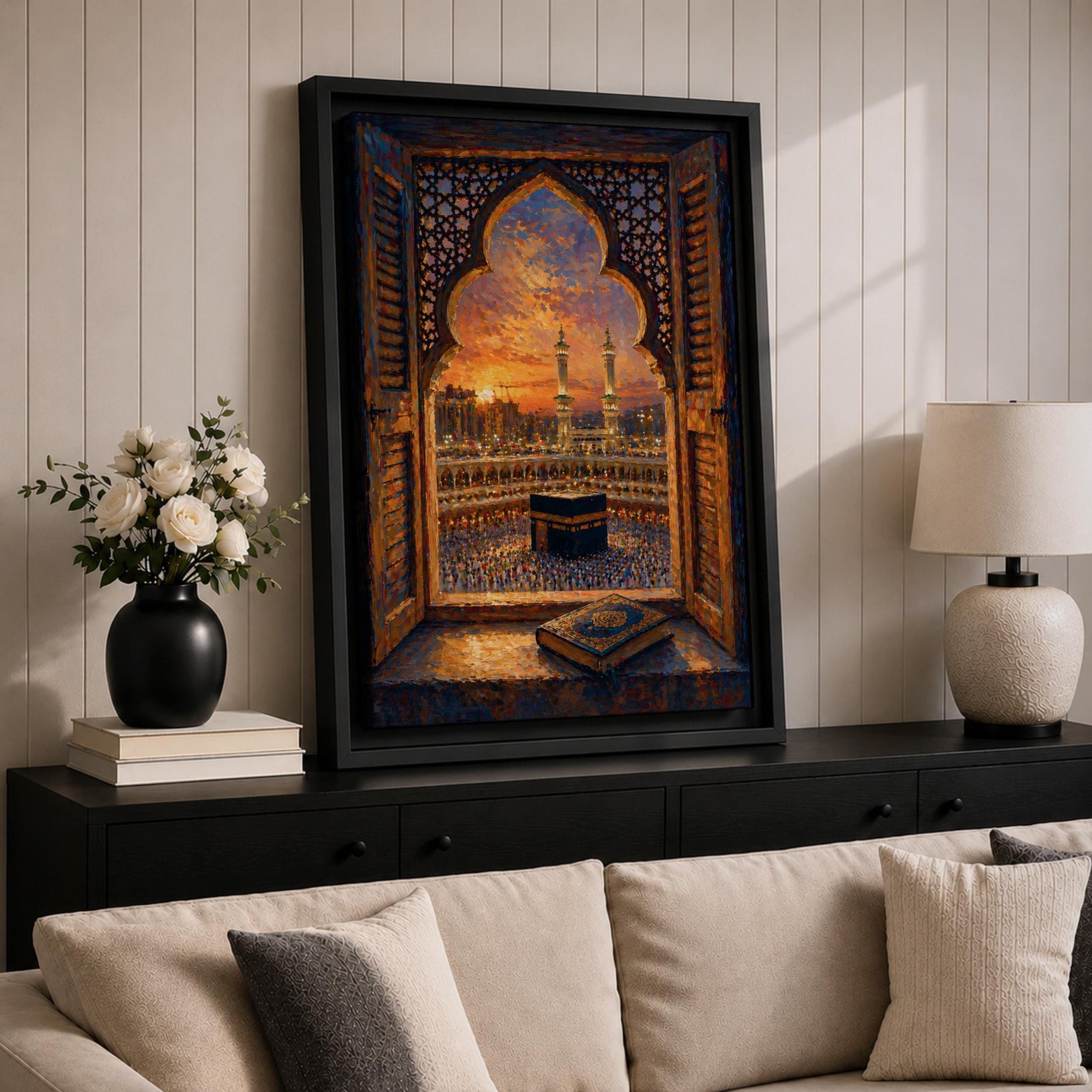 Kaaba wall art viewed through an ornate Islamic arch window overlooking Masjid al Haram at sunset. Featuring the Holy Kaaba, illuminated minarets, and an open Quran in the foreground, this impasto-style Islamic artwork captures a peaceful moment of faith, prayer, and devotion.