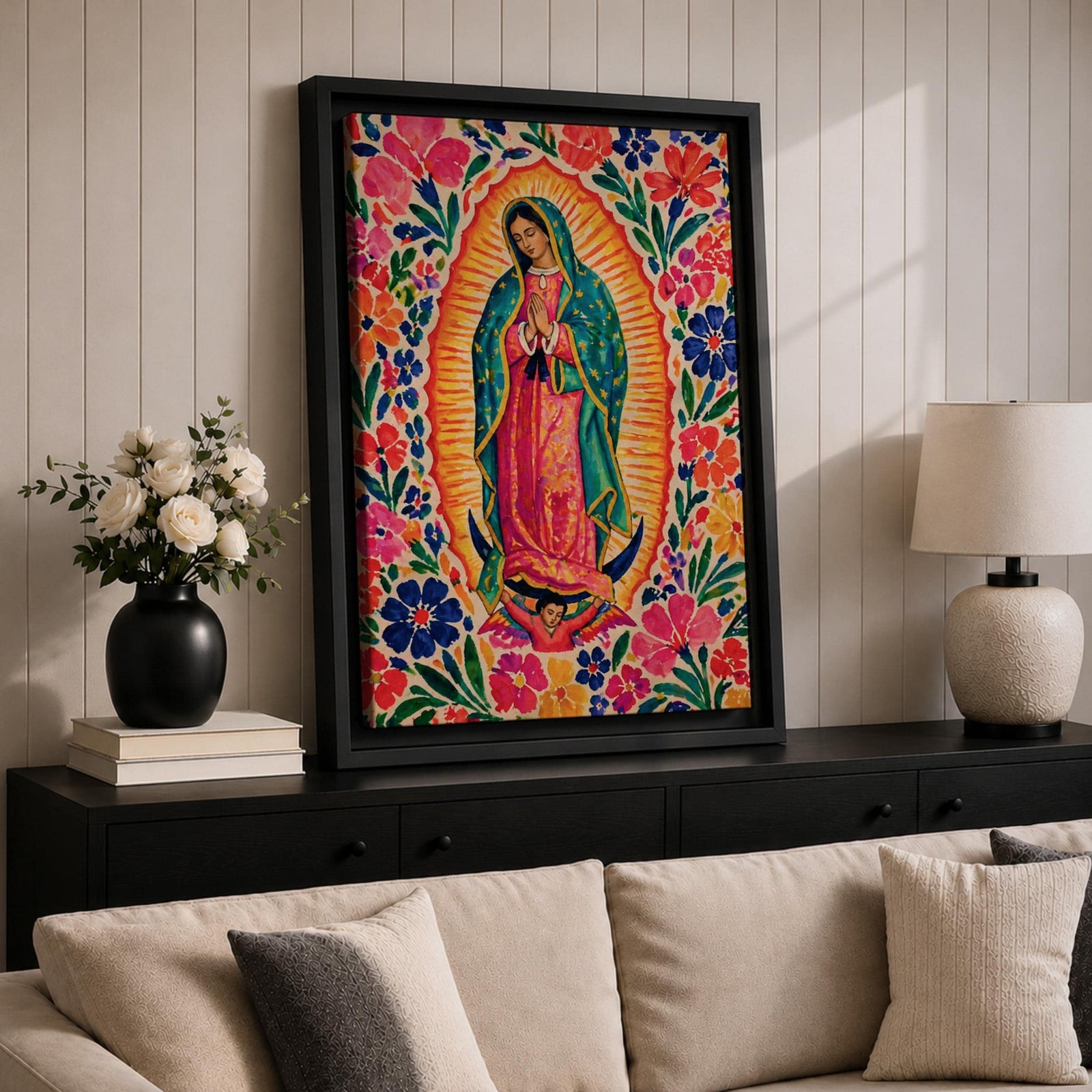 Our Lady of Guadalupe wall art featuring the Virgin Mary in prayer surrounded by vibrant floral folk art patterns and a radiant golden aura. Bright pink, blue, orange, and red blossoms frame this colorful Mexican Catholic artwork, creating a joyful devotional centerpiece for home décor.