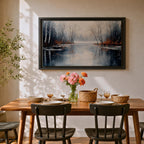 A framed canvas painting depicting a serene winter lake landscape with bare trees reflected in still water. The scene features a quiet woodland setting with leafless trees and subtle earthy tones, capturing the calm and reflective nature of a winter forest by the lake.