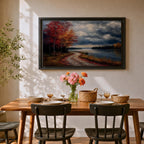 A framed canvas painting depicting an autumn landscape with a winding path along a riverbank, bordered by trees with vibrant fall foliage. The scene captures a moody sky with clouds, rendered in a vintage style emphasizing texture and rich colors.