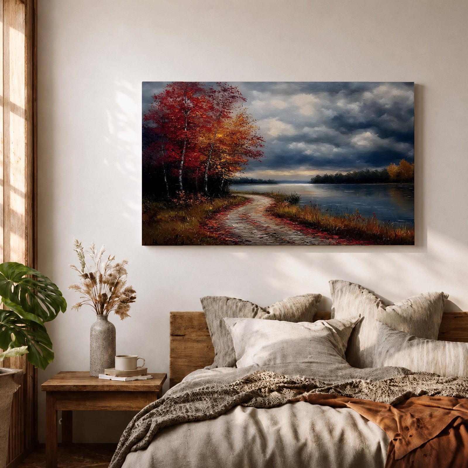 A framed canvas painting depicting an autumn landscape with a winding path along a riverbank, bordered by trees with vibrant fall foliage. The scene captures a moody sky with clouds, rendered in a vintage style emphasizing texture and rich colors.