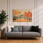 A framed abstract painting of an autumn forest landscape featuring tall slender trees with orange and red foliage and a muted mountain backdrop. The composition uses textured brush strokes to create a modern impression of fall trees in a natural setting.