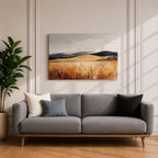 A vintage-style framed canvas painting depicting a vast landscape of golden fields and rolling hills under a muted sky. The textured brushstrokes emphasize the natural prairie scene with tall grasses in the foreground and distant hills, capturing a serene rural environment.
