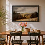 A framed canvas painting depicting a wildflower meadow landscape with rolling hills and clusters of trees under a cloudy sky. The artwork captures a natural countryside scene with detailed brushwork and a warm, rustic atmosphere emphasizing the beauty of open fields and forest edges.