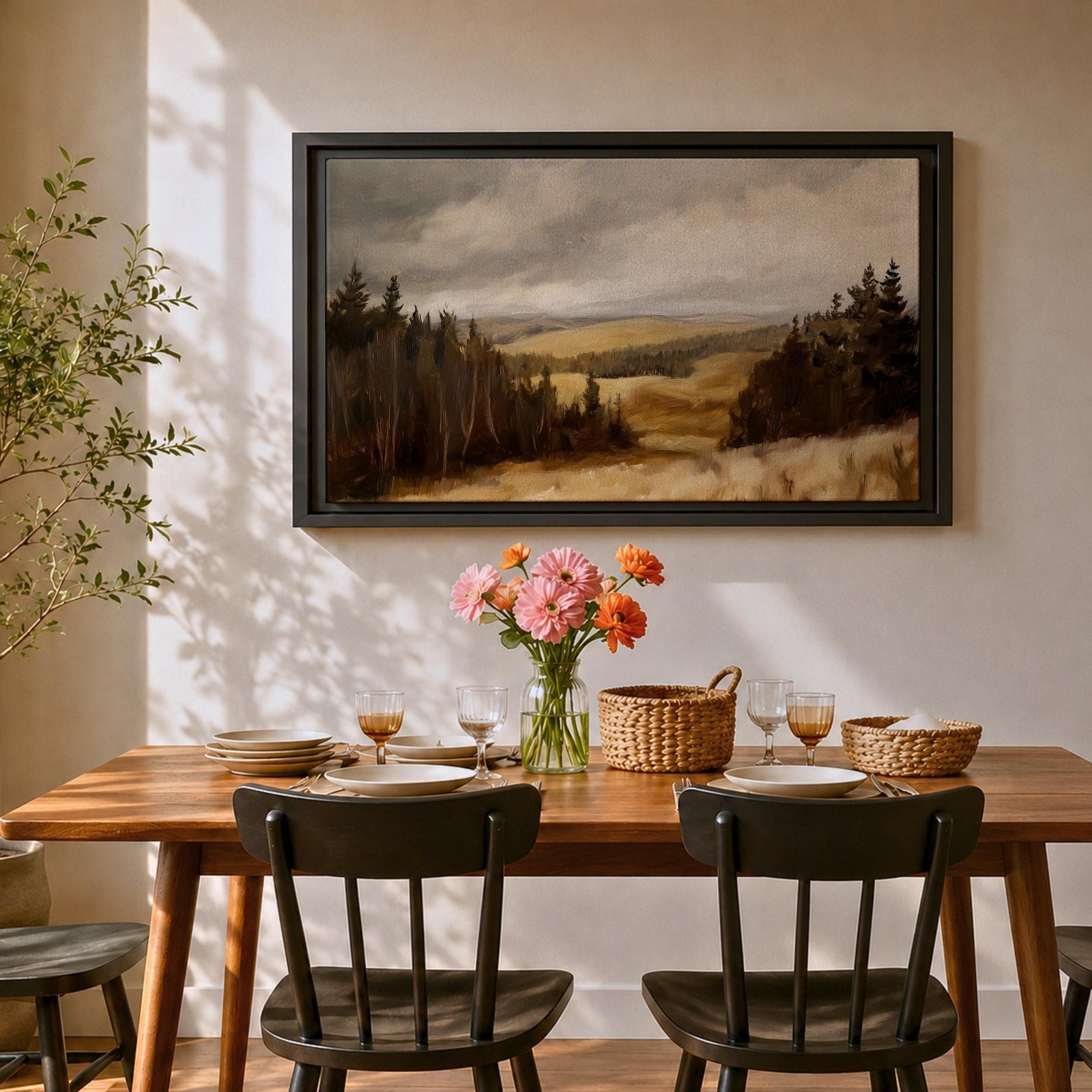 A framed canvas painting depicting a wildflower meadow landscape with rolling hills and clusters of trees under a cloudy sky. The artwork captures a natural countryside scene with detailed brushwork and a warm, rustic atmosphere emphasizing the beauty of open fields and forest edges.