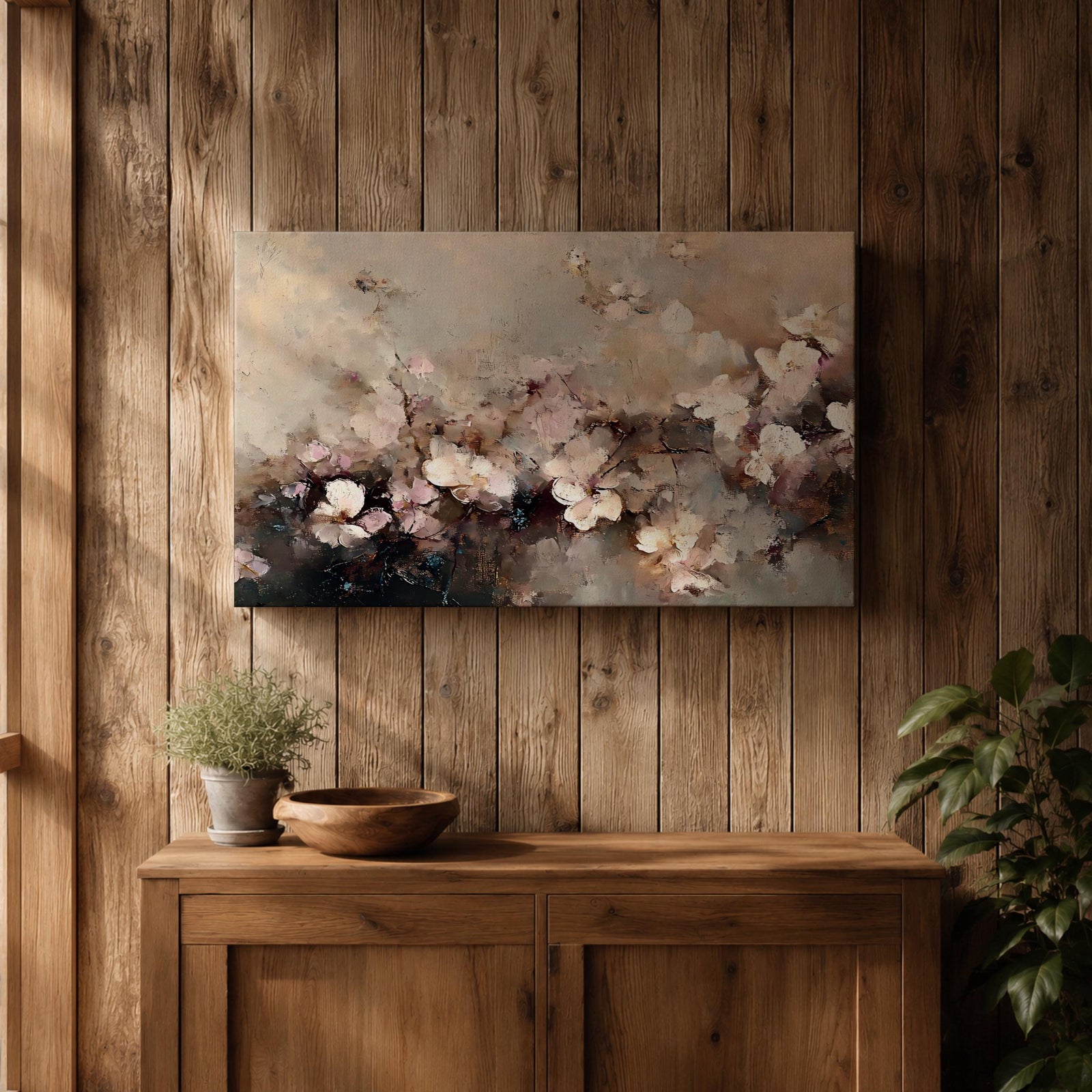 An abstract framed canvas artwork depicting cherry blossom flowers in soft, blurred tones with textured brush strokes creating a delicate floral composition that evokes the beauty of spring blooms in a modern artistic style.