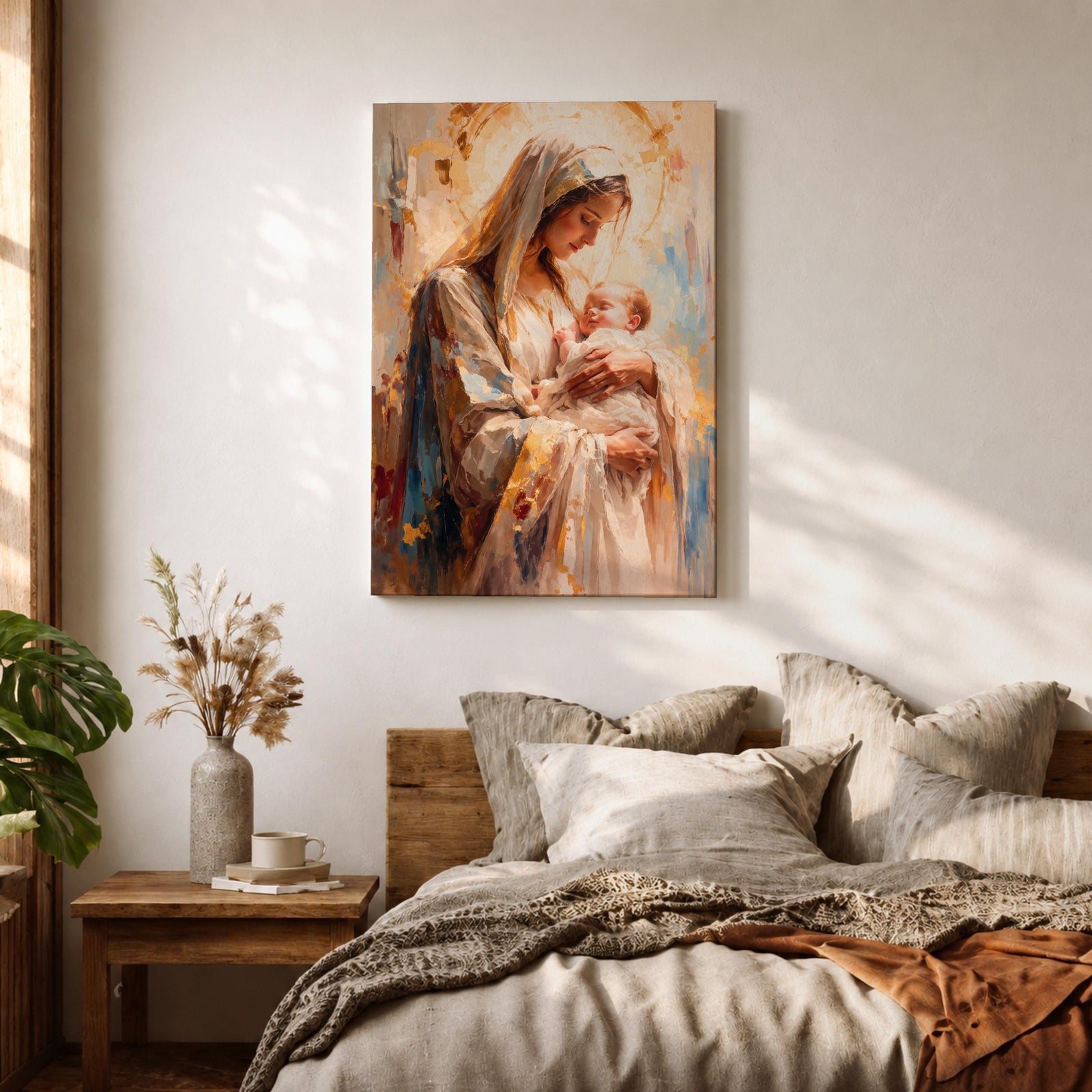 A framed canvas painting depicting Madonna and Child, showing the Virgin Mary tenderly holding baby Jesus. The artwork features soft brush strokes and warm tones, emphasizing the loving bond between mother and child in a classical religious style.