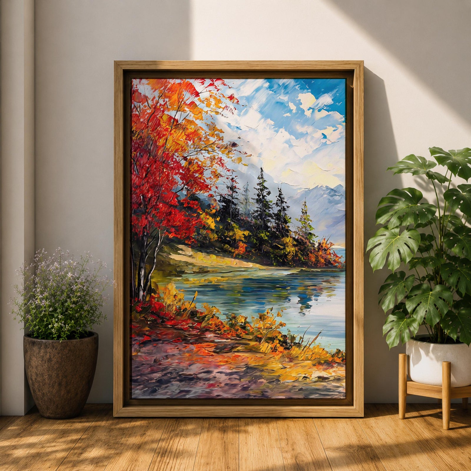 A vibrant impasto painting depicting an autumn lake scene with colorful red and orange foliage on the shore, evergreen trees, and distant mountains under a partly cloudy blue sky, rendered with thick textured brushstrokes creating a rich, dynamic landscape composition.