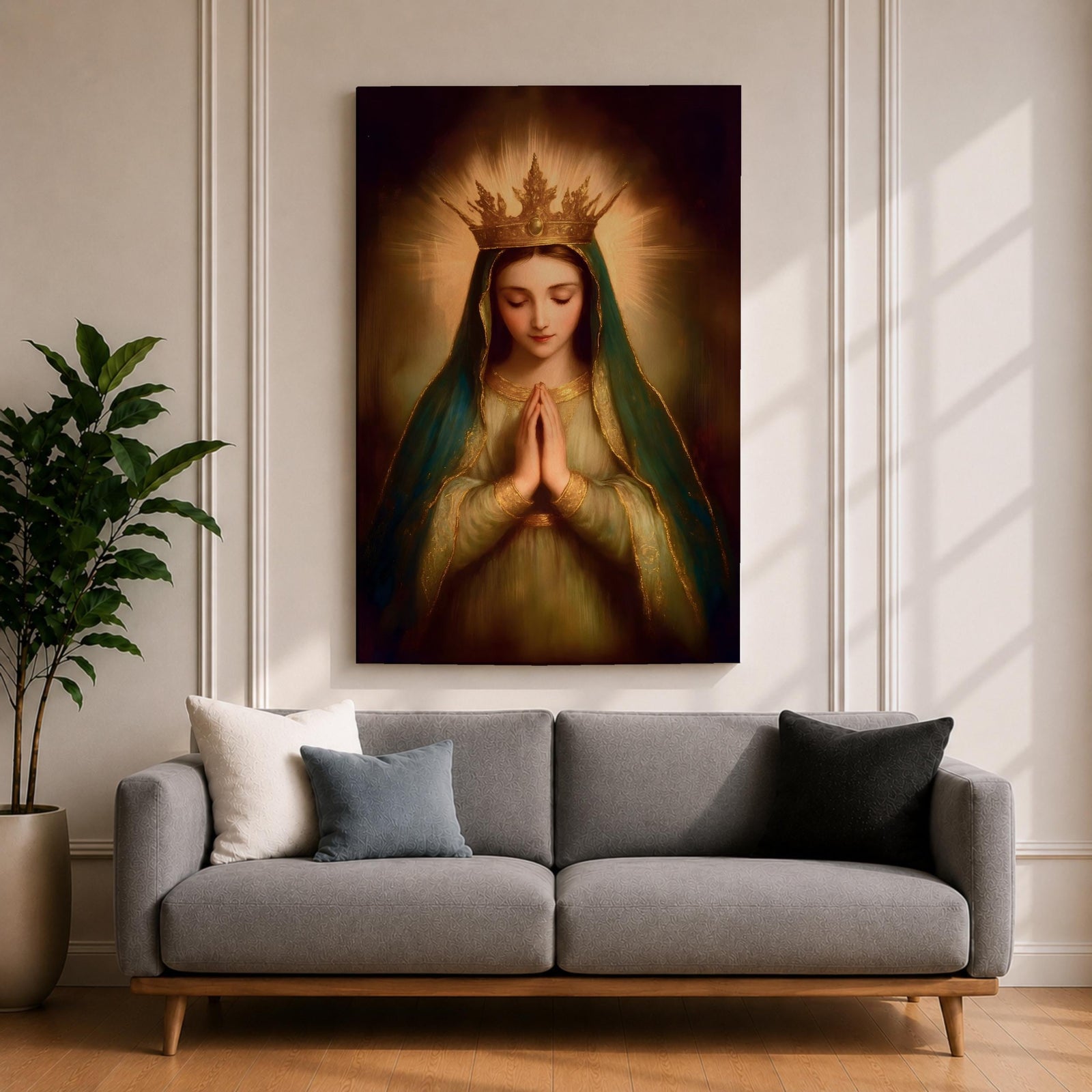 Painting of the Virgin Mary crowned as Queen of Heaven with a radiant golden crown and halo, shown with eyes closed and hands gently folded in prayer. She wears a long veil and flowing robe while soft classical brushwork and a glowing background emphasize the Marian figure in a devotional royal portrait.
